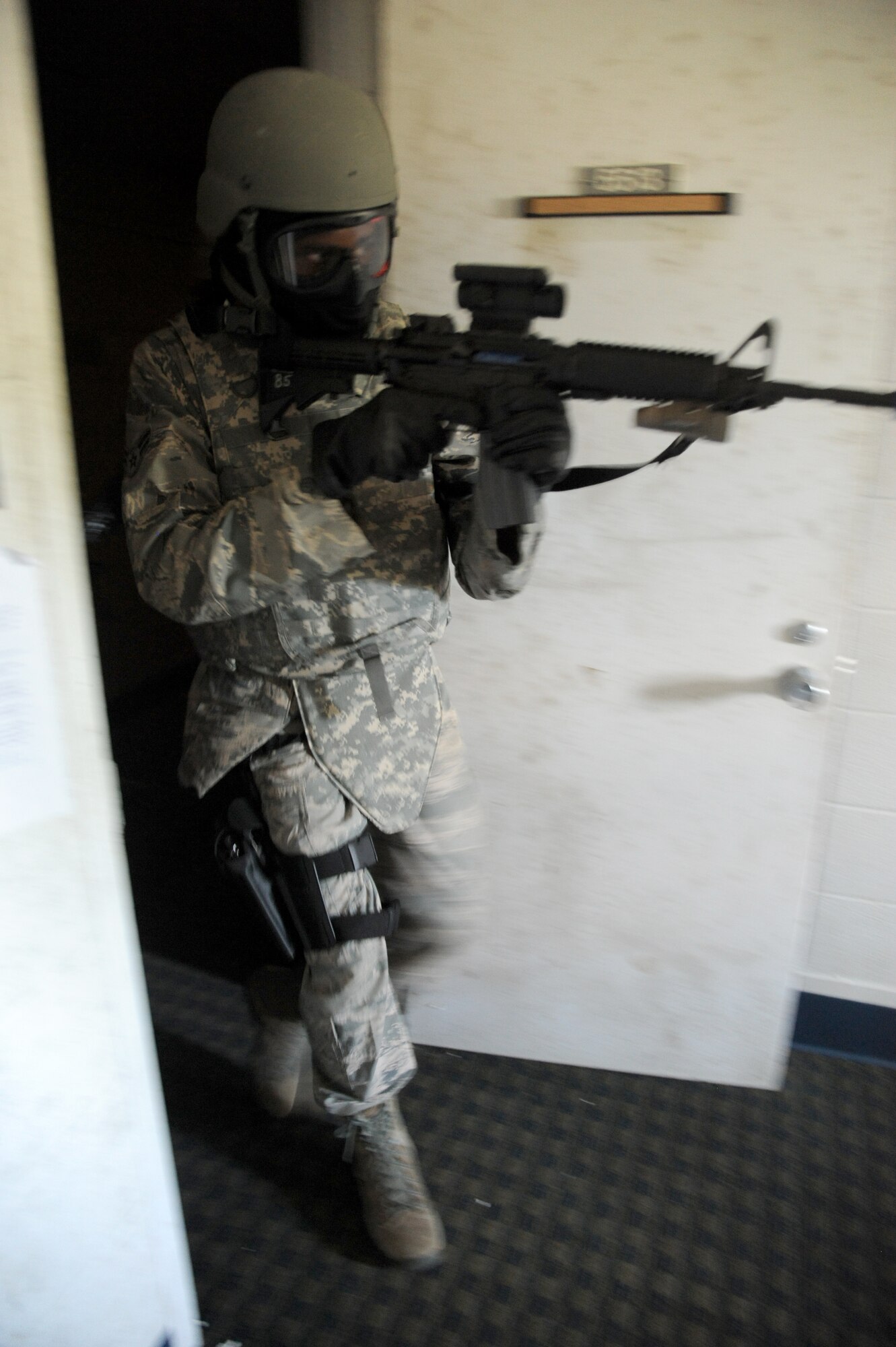 Members of the 81st Security Forces Squadron go through various scenarios simulating real-world conditions for 81st SFS active shooter training May 28, 2013, at The Locker House, Keesler Air Force Base, Miss.  The two-day annual training helps to prepare them to react during real-world situations.   (U.S. Air Force photo by Kemberly Groue)