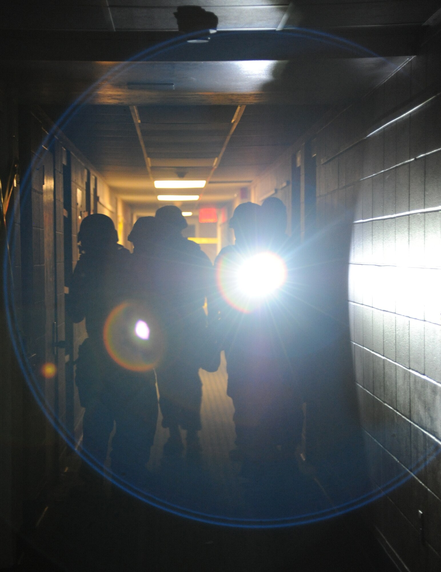 Members of the 81st Security Forces Squadron go through various scenarios simulating real-world conditions for 81st SFS active shooter training May 28, 2013, at The Locker House, Keesler Air Force Base, Miss.  The two-day annual training helps to prepare them to react during real-world situations.   (U.S. Air Force photo by Kemberly Groue)