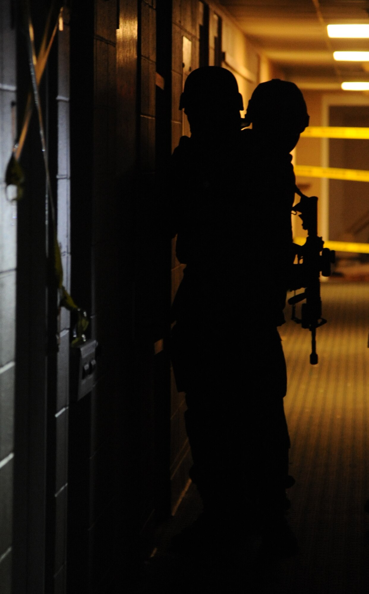 Members of the 81st Security Forces Squadron go through various scenarios simulating real-world conditions for 81st SFS active shooter training May 28, 2013, at The Locker House, Keesler Air Force Base, Miss.  The two-day annual training helps to prepare them to react during real-world situations.   (U.S. Air Force photo by Kemberly Groue)