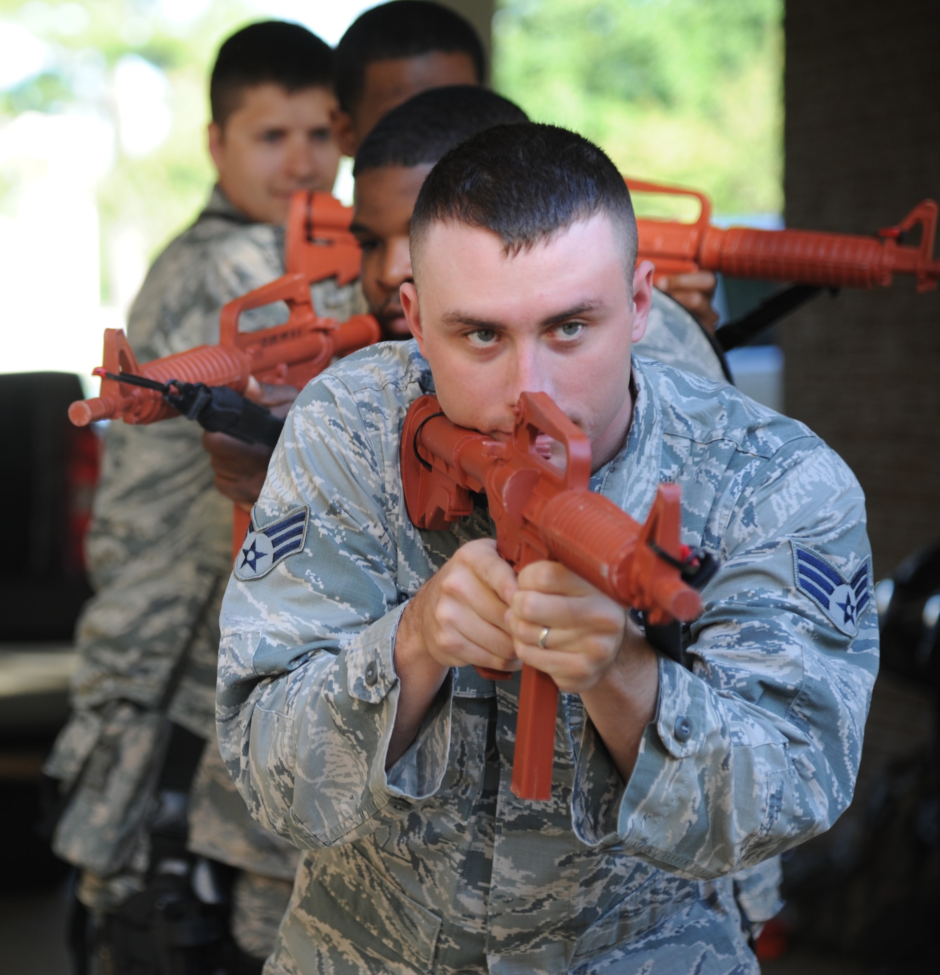 Senior Airman Chad Byrne, 81st Security Forces Squadron, leads his team through a scenario during 81st SFS active shooter training May 28, 2013, at The Locker House, Keesler Air Force Base, Miss.  The two-day annual training helps to prepare them to react during real-world situations.  (U.S. Air Force photo by Kemberly Groue)