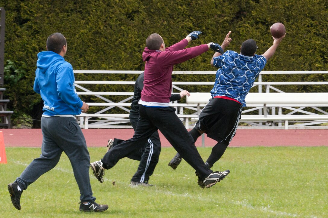 RAF ALCONBURY, United Kingdom – Senior Airman Tyre Jones, 423rd Medical Squadron, stretches out for the ball during a DefenderBall game that was played as part of teh 423rd ABG Sport Day May 24. (U.S. Air Force photo by Staff Sgt. Brian Stives)
