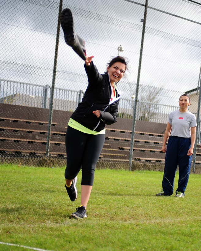 MENWITH HILL, United Kingdom - Ashley Olivas, Team China, competes in the welly toss during the 421st Air Base Group Sports Day Olympics May 23, 2013, at Royal Air Force Menwith Hill, United Kingdom. Seventeen three-person "countries" participated in five events, including the welly toss, football toss, free-throw competition, video game archery competition and relay race that consisted of a 1,000-meter row, one-mile run and two-mile bike. (U.S. Air Force photo by Staff Sgt. Debbie Lockhart)