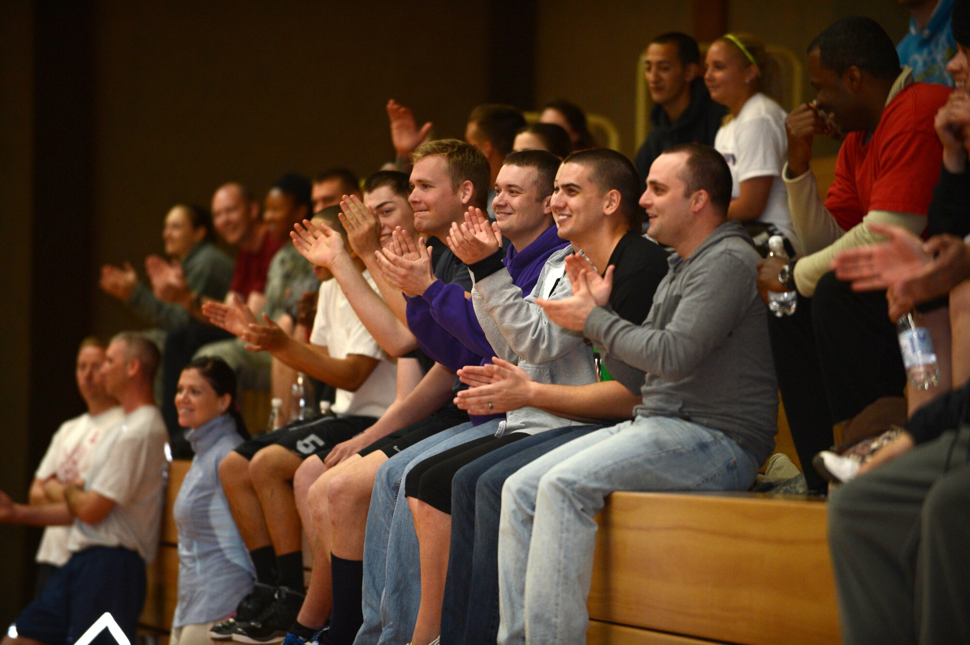 SPANGDAHLEM AIR BASE, Germany – Airmen cheer for their squadrons during a dodge ball event during the wing sports day May 30, 2013. Sports day consisted of various sporting activities and a free barbeque for lunch. (U.S. Air Force photo by Airman 1st Class Kyle Gese/Released)