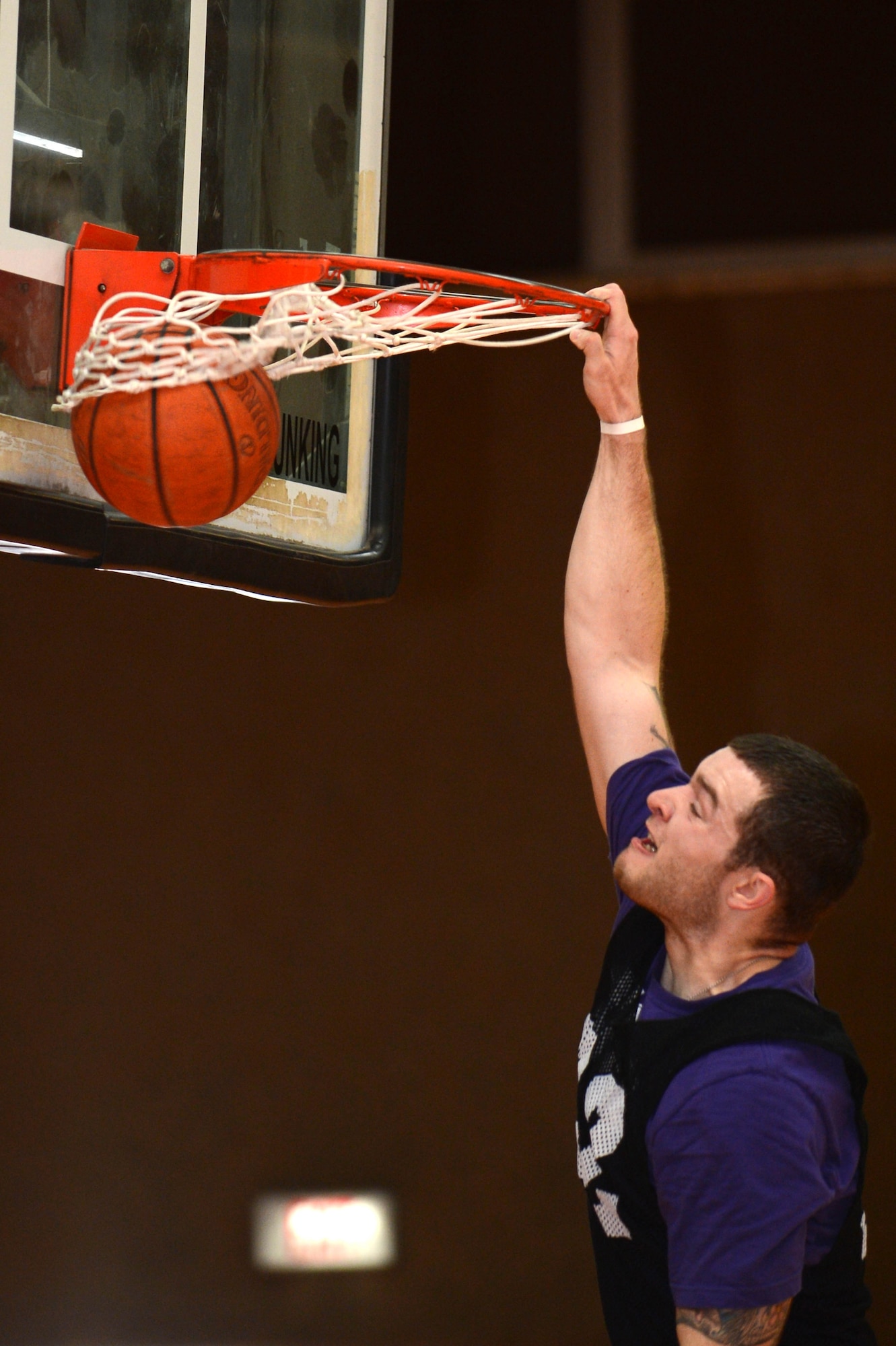 SPANGDAHLEM AIR BASE, Germany -- U.S. Air Force Senior Airman Michael Parson, 52nd Civil Engineer Squadron from Fort Walton Beach Fl., dunks a basketball during a wing sports day competition May 30, 2013. Sports day allowed Airmen to come together in efforts to increase camaraderie and esprit de corps. (U.S. Air Force photo by Airman 1st Class Kyle Gese/Released)