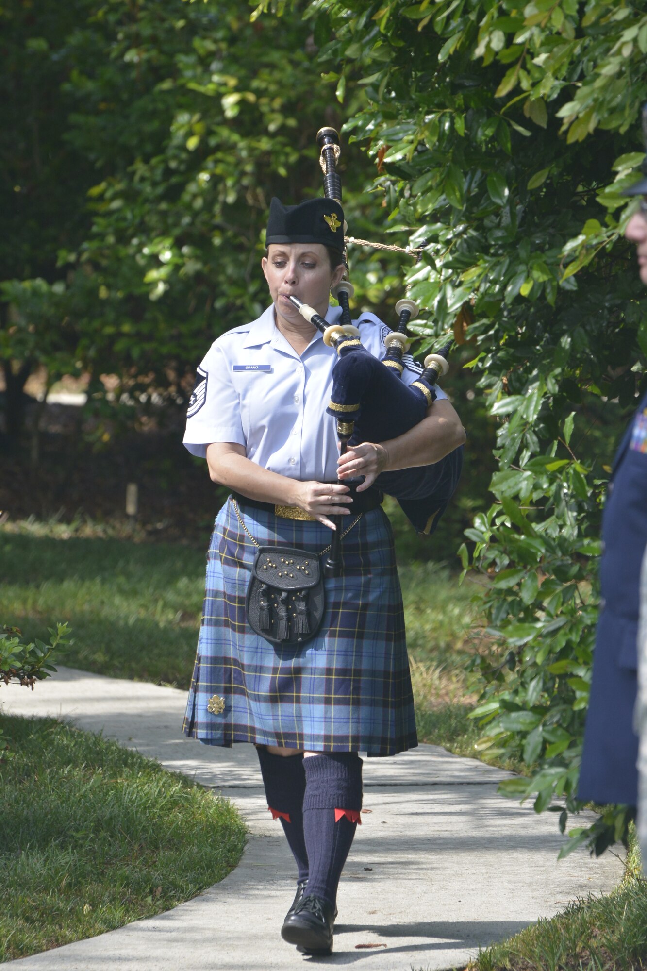 The annual Camellia Gardens Memorial Service paid tribute to 59 deceased members of Team Robins May 23 in the tranquil garden across from the Horizons Event Center. Maj. Gen. Craig Gourley, Air Force Reserve Command vice commander, delivered the memorial address, the base honor guard delivered a 21-gun salute and taps was played. The service is a 37-year tradition rooted in a partnership between Robins, the Middle Georgia Camellia Society and the Robins Regional Chamber of Commerce. The three teamed in 1976 to establish and dedicate the garden. At the garden’s entrance, a brick and mortar wall displays gold plaques with the names of 1,896 deceased military and civilian members from Robins who were honored in past ceremonies.  (U.S. Air Force photo by Raymond Crayton/Released)
 