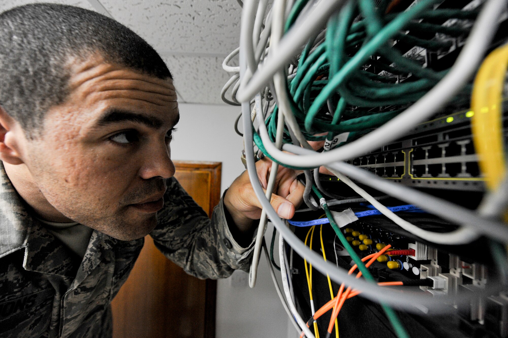 U.S. Air Force Senior Airman Nicholas Simmons, 380th Expeditionary Medical Group systems technician, checks the server for connectivity at an undisclosed location in Southwest Asia, May 14, 2013. Simmons’ job is to ensure that all medical personnel computer systems are operating properly and can communicate with medical databases and stateside servers. Simmons is native to Berlin, Germany, and is deployed from Seymour Johnson Air Force Base, N.C. (U.S. Air Force photo by Staff Sgt. Joshua J. Garcia)  