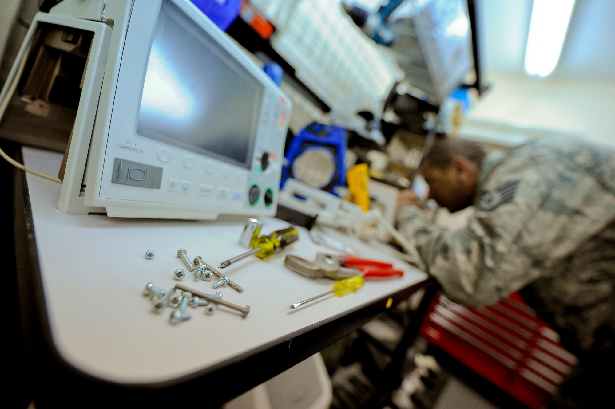 U.S. Air Force Staff Sgt. Anthony Orme, 380th Expeditionary Medical Group bioenvironmental maintainer, uses a multimeter to ensure a defibrillator has an electric charge at an undisclosed location in Southwest Asia, May 14, 2013. Orme performs preventative maintenance on all medical equipment within the group. Orme hails from Weirton, W.V., and is deployed from Tyndall Air Force Base, Fla. (U.S. Air Force photo by Staff Sgt. Joshua J. Garcia)