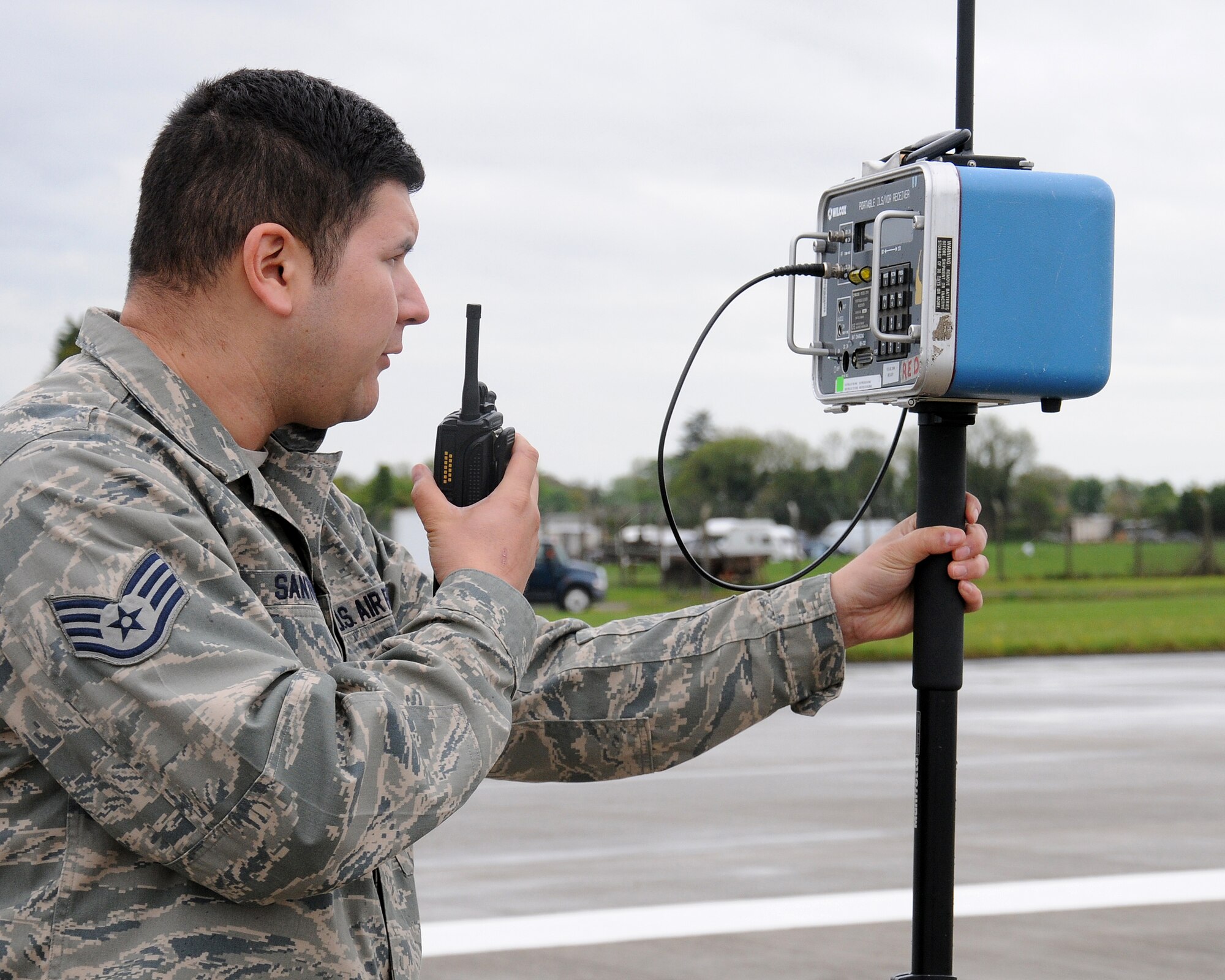 Staff Sgt. Sergio Santos, 100th Communications Squadron Airfield Systems team lead from Los Angeles, Calif., checks the radio frequency signal on the runway May 24, 2013, on RAF Mildenhall, England. The airfield systems shop has nine personnel working to ensure aircraft are able to land safely, no matter what the weather. (U.S. Air Force photo by Gina Randall/Released)