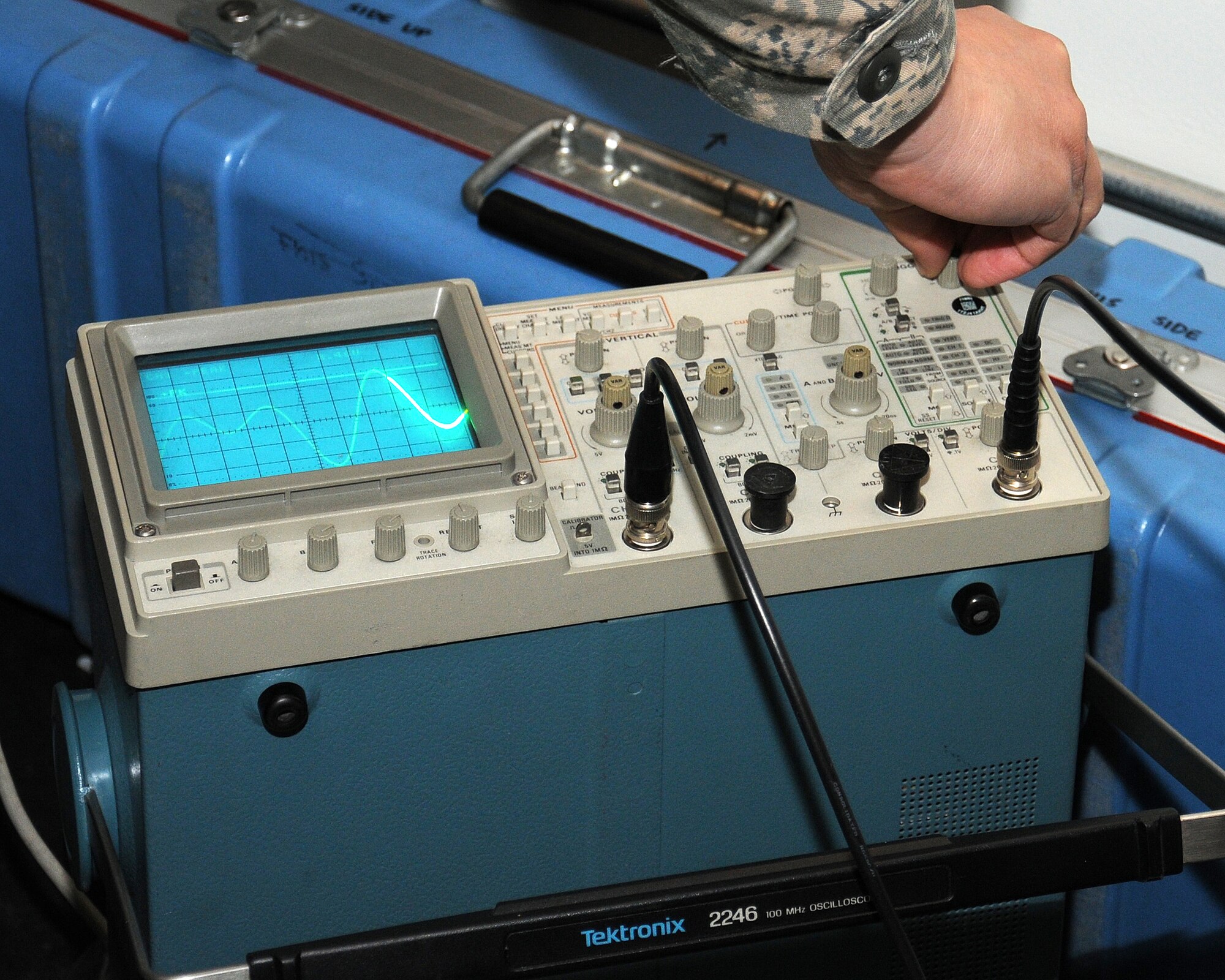 Staff Sgt. Sergio Santos, 100th Communications Squadron Airfield Systems team leader from Los Angeles, Calif., views the audio signal from the navigational landing system on an oscilloscope to ensure the system is correctly aligned May 24, 2013, on RAF Mildenhall, England. The airfield systems shop maintains the navigational system which helps guide aircraft to land safely — critical during inclement weather conditions. (U.S. Air Force photo by Gina Randall/Released)