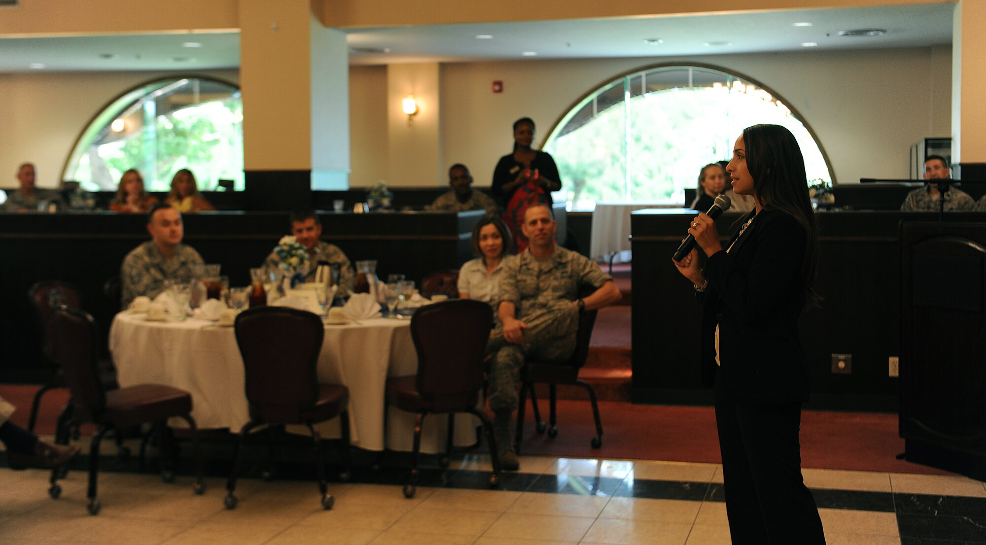 Rachel Luna, former U.S. Marine, speaks at the key spouse appreciation breakfast at the Officer's Club on Kadena Air Base, Japan, May 31, 2013. Luna, now a key spouse, gave the group words of encouragement to get involved in their community and say "I will" instead of "I can." (U.S. Air Force photo by Airman 1st Class Malia Jenkins/Released)