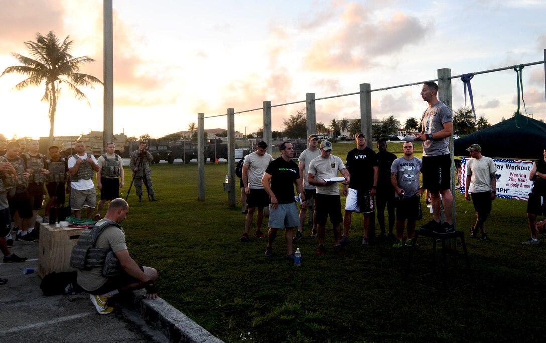 Staff Sgt. Stephen Baker, 736th Security Forces Squadron training NCO in charge, explains the requirements for the Memorial Day CrossFit “Murph,” May 23, 2013, on Andersen Air Force Base, Guam. The workout consisted of a one-mile run, 100 pull-ups, 200 pushups, 300 squats, then another one-mile run to pay homage to service members who made the ultimate sacrifice in the line of duty. (U.S. Air Force photo by Airman 1st Class Mariah Haddenham/Released)