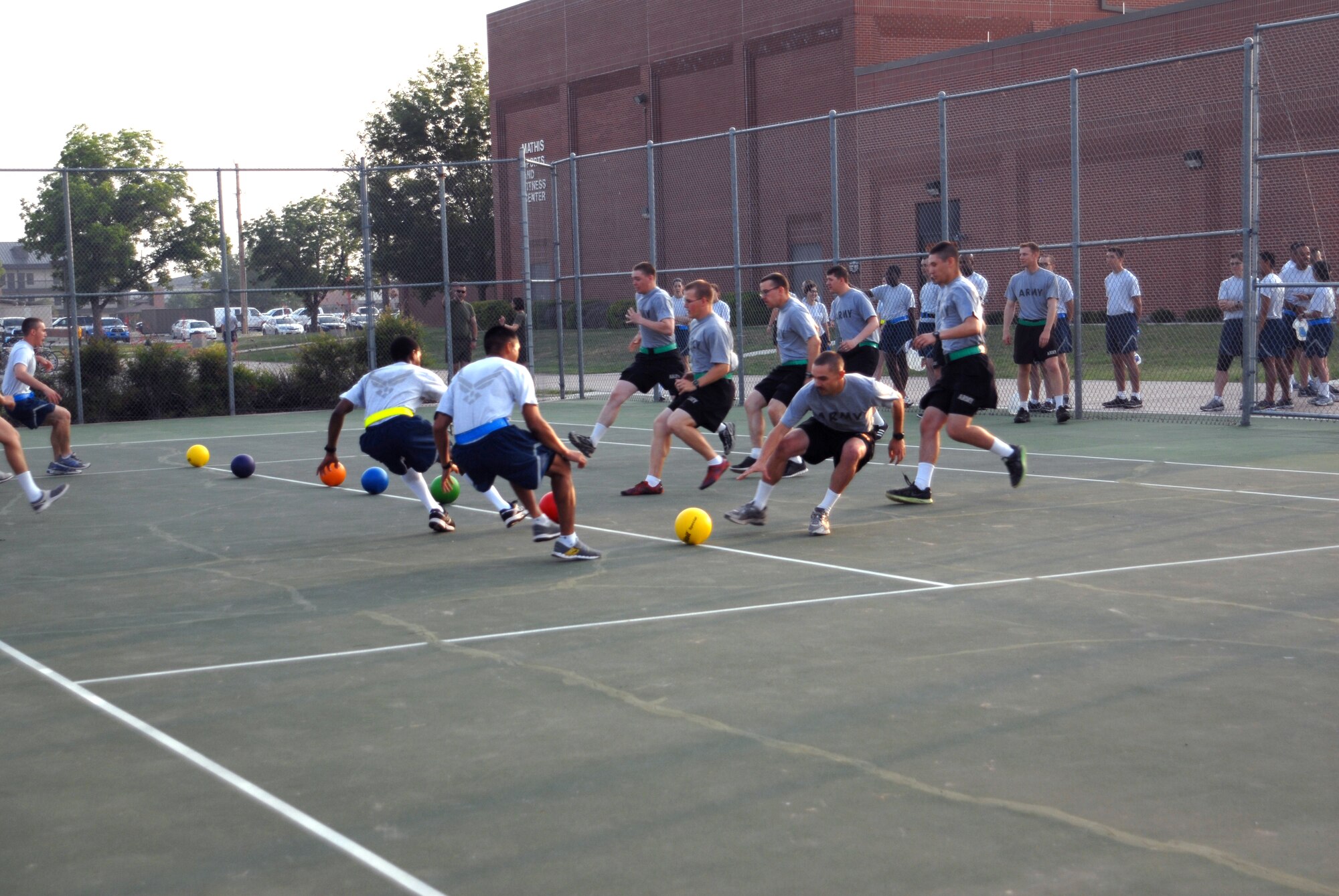 GOODFELLOW AIR FORCE BASE, Texas – Air Force students battle Army 344th Military Intelligence Battalion students in a game of dodge ball during Sports and Safety Day at the Mathis Fitness Center, May 23.  Team Goodfellow devoted the day to safety and sports to kick off the 101 Critical Days of Summer. (U.S. Air Force photo/ Airman 1st Class Breonna Fields) 
