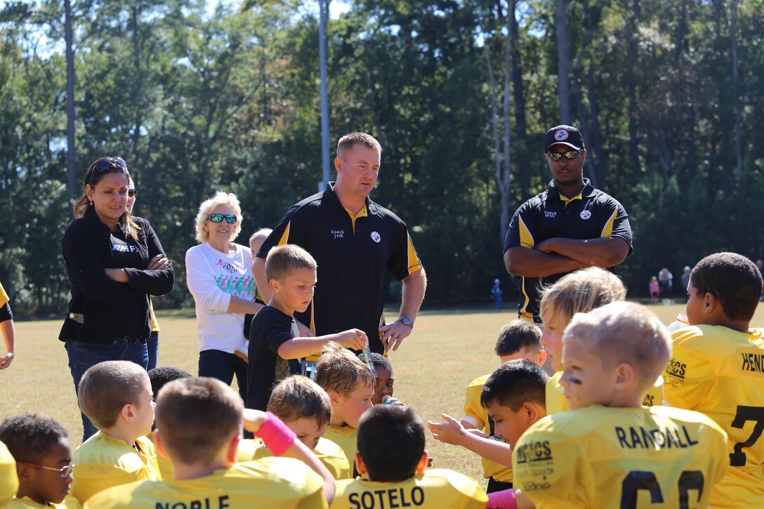 The Laurel Bay Steelers, a 9-10 youth sports football team, receive a pep talk from their coach as they prepare to play in the Beaufort County championship game, Oct. 28, at Beaufort, S.C. The Steelers won the championship, ending their season with a 8-1 record.