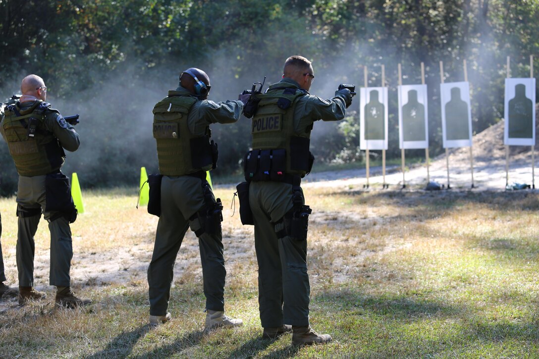 Marines with the Special Reaction Team fire an M9 pistol during a sustainment training exercise in Charleston, S.C., Oct. 23. The SRT is a part of the Provost Marshal's Office and provides a quick-reaction force for extreme situations.
