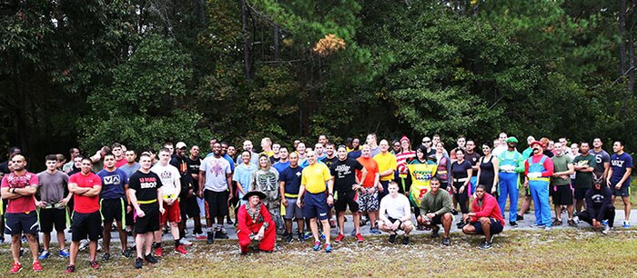 Service members with 2nd Medical Battalion, Combat Logistics Regiment 25, 2nd Marine Logistics Group pose for a photo before a zombie run aboard Camp Lejeune, N.C., Oct. 31, 2013. The course was approximately one mile in length and had zombies located in various points to try to “infect” runners and turn them into zombies. (U.S. Marine Corps photo by Lance Cpl. Shawn Valosin)