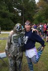 Petty Officer First Class Martha Harrigan (left) poses for a picture with Chief Petty Officer Alisha Thijs before a zombie run held by 2nd Medical Battalion, Combat Logistics Regiment 25, 2nd Marine Logistics Group aboard Camp Lejeune, N.C., Oct. 31, 2013. Harrigan was instrumental in organizing the event, which allowed service members to have fun while conducting physical training. (U.S. Marine Corps photo by Lance Cpl. Shawn Valosin)