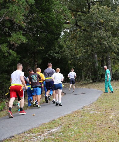 Service members with 2nd Medical Battalion, Combat Logistics Regiment 25, 2nd Marine Logistics Group encounter their first zombies during a zombie run aboard Camp Lejeune, N.C., Oct. 31, 2013 The run was designed to build camaraderie while conducting physical training and celebrating the holiday. (U.S. Marine Corps photo by Lance Cpl. Shawn Valosin)