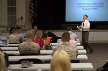 Daryl Witt, a representative from the Family Care Programs Branch, or FCP, talks to new members of 8th Engineer Support Battalion, 2nd Marine Logistics Group and their families about Camp Lejeune’s child development center and Exceptional Family Member Program during a meet and greet aboard Camp Lejeune, N.C., Oct. 30, 2013. The mission of the FCP is to support active duty service members who have dependents with special needs by providing case workers to arrange the use of off-base resources and personally assist the family members. 