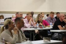 Marines and sailors who recently joined 8th Engineer Support Battalion, 2nd Marine Logistics Group and their families listen to representatives from several family-support groups and other community services during a new join meet and greet aboard Camp Lejeune, N.C., Oct. 30, 2013. Each representative provided information on assets each program can provide to help make their time aboard Camp Lejeune as easy as possible. 