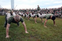 Marines with 2nd Maintenance Battalion, Combat Logistics Regiment 25, 2nd Marine Logistics Group perform squad push-ups during a field meet at the 2nd Maint. Bn. compound aboard Camp Lejeune, N.C., Oct. 31, 2013. Each company within the battalion had to select a few Marines to represent their own companies throughout the day’s festivities. 