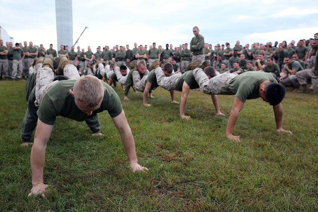 Marines with 2nd Maintenance Battalion, Combat Logistics Regiment 25, 2nd Marine Logistics Group perform squad push-ups during a field meet at the 2nd Maint. Bn. compound aboard Camp Lejeune, N.C., Oct. 31, 2013. Each company within the battalion had to select a few Marines to represent their own companies throughout the day’s festivities. 
