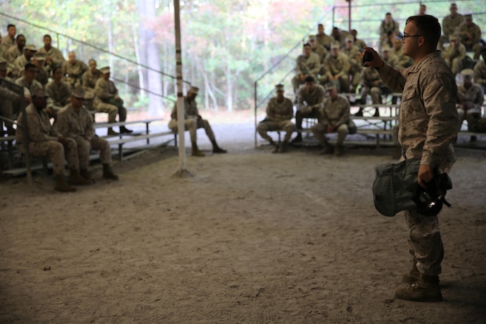Lance Cpl. Justin M. Fanning, a chemical, biological, radiological and nuclear defense specialist with Combat Logistics Regiment 27, 2nd Marine Logistics Group, gives a review class about the M50 Joint Service General Purpose Mask aboard Camp Lejeune, N.C., Oct. 31, 2013. Approximately 120 service members with 2nd Supply Battalion, Combat Logistics Regiment 25, 2nd MLG received classes on the proper use of M50 Joint Service General Purpose Masks and Mission Oriented Protective Posture clothing during CBRN attacks before testing their confidence inside a gas chamber.