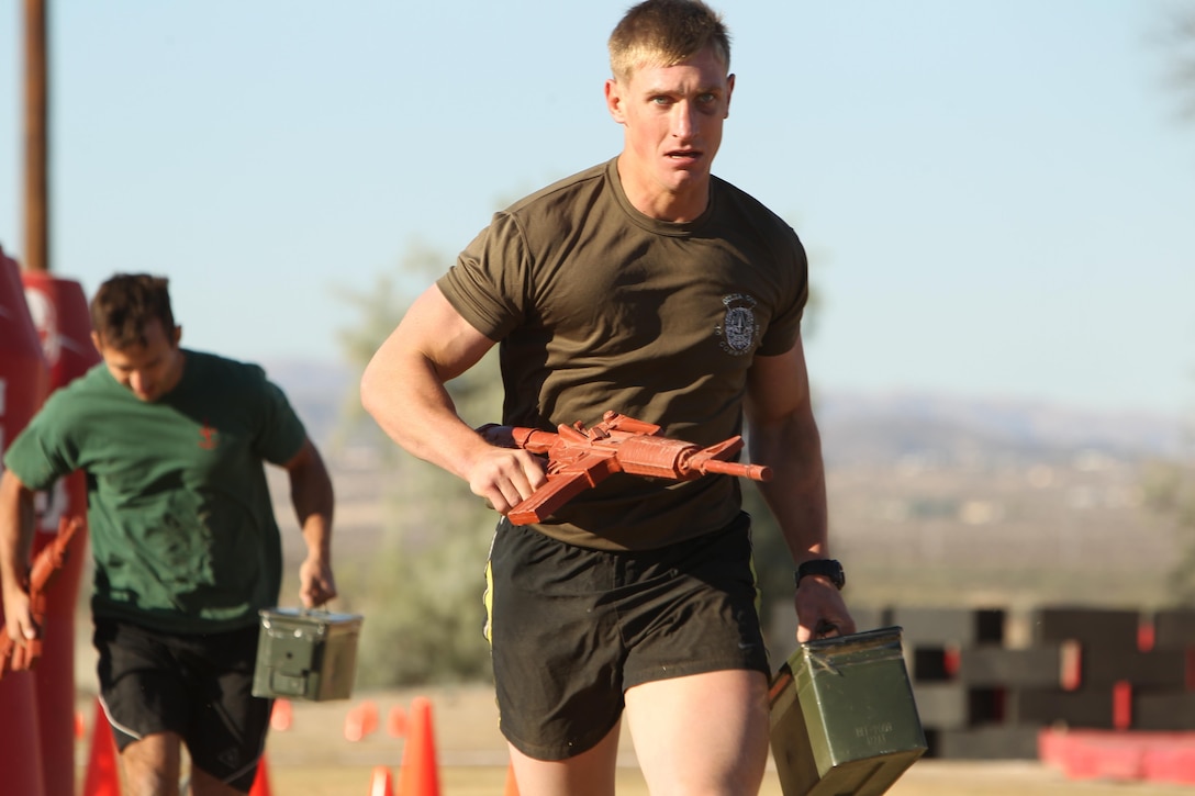 Royal Marines with 40 Commando Royal Marines race to the finish line during the last portion of the competition Oct. 25, 2013.