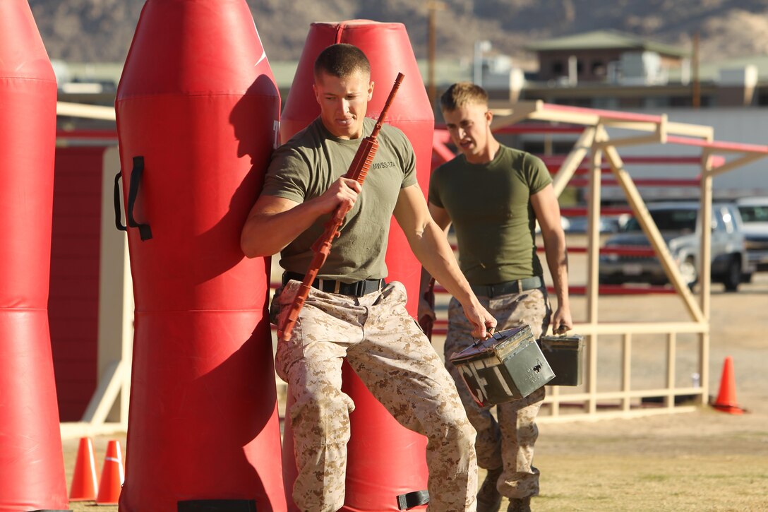 Marines with Marine Wing Support Squadron 374 weave through obstacles as part of the annual Combat Center Challenge Oct. 25.
