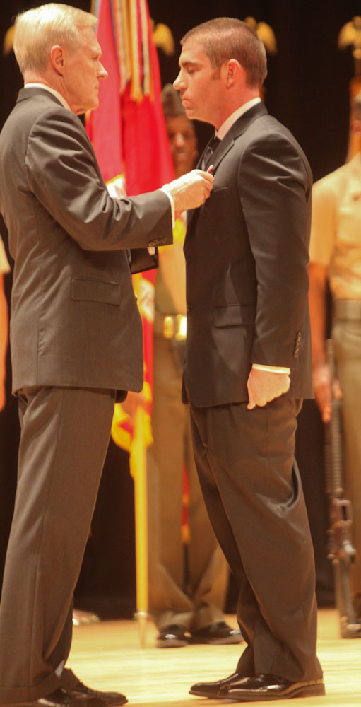 MARINE CORPS BASE CAMP LEJEUNE, N.C. – Sgt. Justin Tygart, a native of Orlando, Fla., is presented the Bronze Star Medal by the Secretary of the Navy, the Honorable Ray Mabus, at an award ceremony aboard Camp Lejeune, N.C., Nov. 1, 2013. Tygart was one of four to be presented with awards for heroic and selfless actions while deployed to Afghanistan in 2011, with 2nd Battalion, 8th Marine Regiment. 