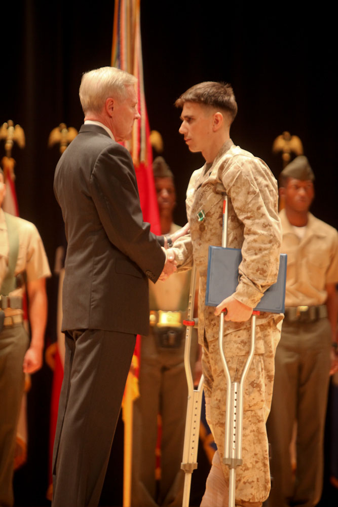 MARINE CORPS BASE CAMP LEJEUNE, N.C. – Cpl. Gaven Eier, a native of Charleston, S.C., is presented the Navy and Marine Corps Commendation Medal by the Secretary of the Navy, the Honorable Ray Mabus, at an award ceremony aboard Camp Lejeune, N.C., Nov. 1, 2013. Elias was one of four to be presented with awards for heroic and selfless actions while deployed to Afghanistan in 2011, with 2nd Battalion, 8th Marine Regiment.