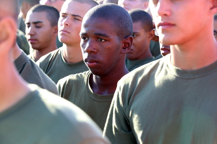 Pvt. Sovaja R. Knox, Platoon 3241, Company I, 3rd Recruit Training Battalion, listens to the route brief of the 3-mile portion of the PFT aboard the depot, Oct.17. Knox found sanctuary through music and wants to study music production after his service in the Marine Corps.