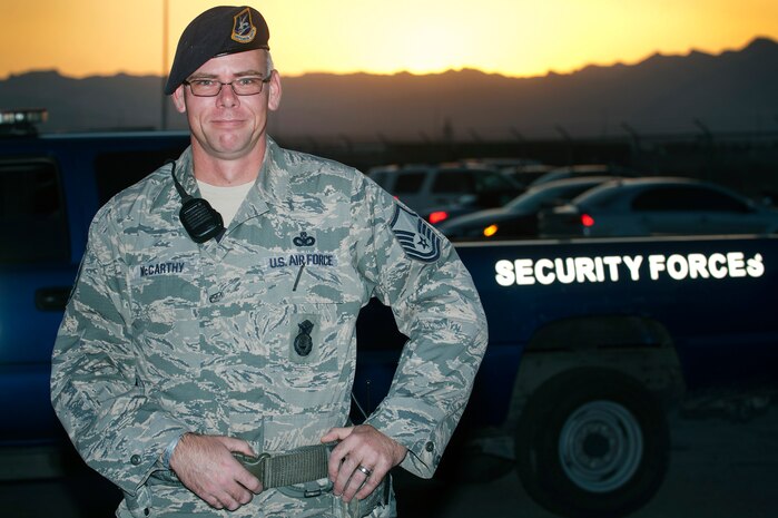 Master Sgt. Luke McCarthy, 99th Security Forces Squadron Charlie One flight chief, stands by his vehicle prior to starting his shift Oct. 20, 2013, at Nellis Air Force Base, Nev. McCarthy supports Life of a Warrior initiative driven events for Nellis and Creech AFBs and distinguishes himself in his personal physical fitness, accomplishing multiple half marathons and 50 mile runs. The Life of a Warrior initiative challenges Airmen to grow in the physical, mental, social and spiritual areas of their lives and to invest in positive growth rather than a destructive lifestyle. (U.S. Air Force photo by Staff Sgt. Christopher Hubenthal)