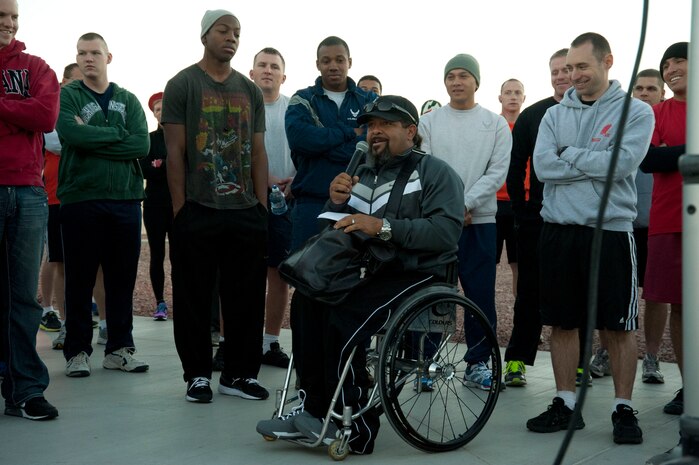 Bill Eddins, Wounded Warrior Camp instructor, speaks to participants and thanks armed forces members for their service in support of National Disability Employment Awareness Month during the Halloween 5 kilometer run outside the Warrior Fitness Center Oct. 31, 2013, at Nellis Air Force Base, Nev. National Disability Employment Awareness Month is aimed at educating 