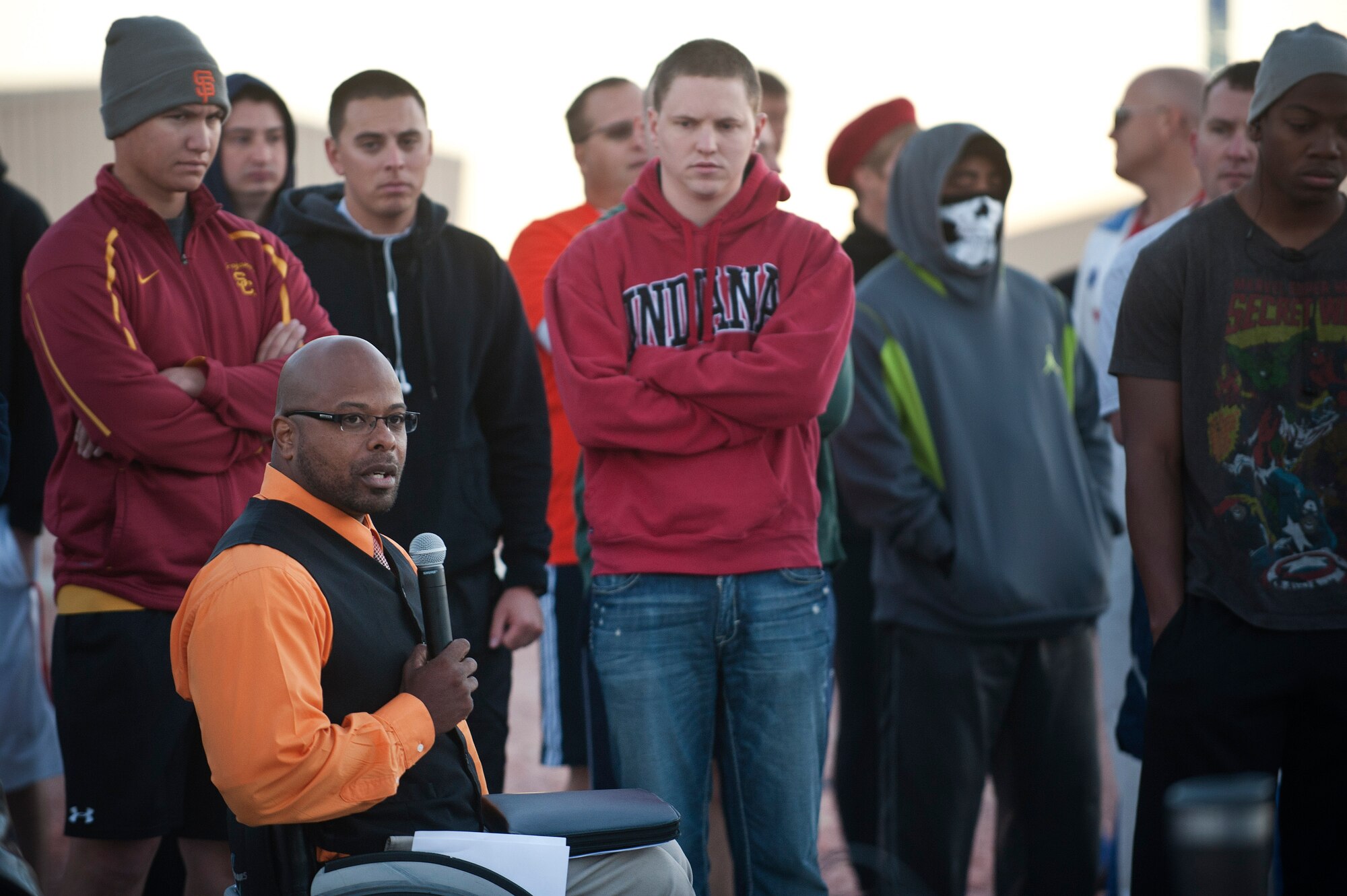Reggie Bennett, Rebuilding All Goals Efficiently executive director, thanks armed forces members and wounded warriors for their service in support of National Disability Employment Awareness Month during the Halloween 5 kilometer run outside the Warrior Fitness Center Oct. 31, 2013, at Nellis Air Force Base, Nev. National Disability Employment Awareness Month is aimed at educating people without disabilities that those with disabilities are equal in accomplishing life's tasks. (U.S. Air Force photo by Staff Sgt. Christopher Hubenthal)