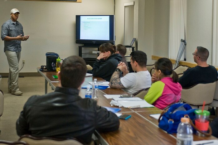 Staff Sgt. Cory Green, 99th Security Forces Squadron combat arms training and maintenance instructor, teaches a Nevada concealed weapons course at outdoor recreation Oct. 26, 2013, at Nellis Air Force Base, Nev. In order to obtain a concealed carry permit, applicants must take and pass a concealed firearms qualification course taught by a certified firearms instructor. (U.S. Air Force photo by Senior Airman Matthew Lancaster)