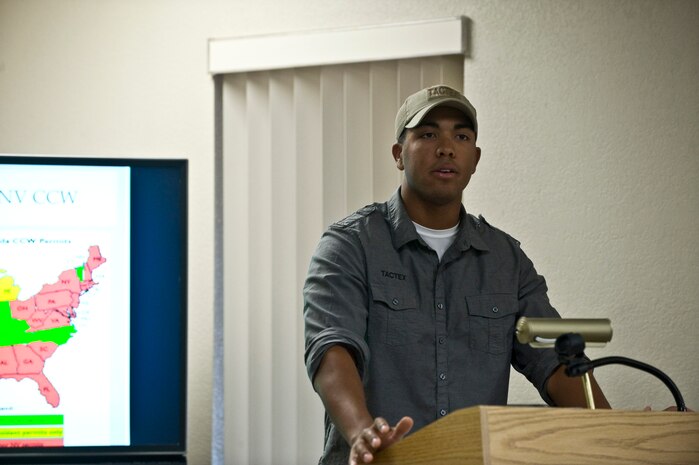 Staff Sgt. Cory Green, 99th Security Forces Squadron combat arms training and maintenance instructor, briefs applicants on what states honor the Nevada concealed carry permit during a Nevada concealed weapons course at outdoor recreation Oct. 26, 2013, at Nellis Air Force Base, Nev. The course provides information on concealed firearms including proper use, Nevada laws regarding a concealed weapon, and how to be prepared for situations when people may use their firearm. (U.S. Air Force photo by Senior Airman Matthew Lancaster)