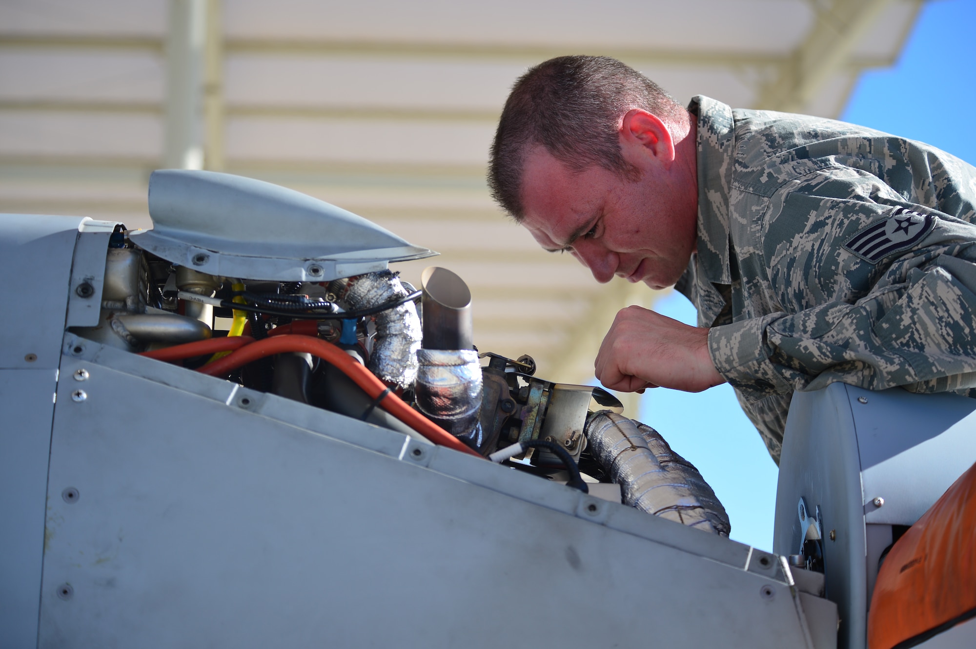 LAS VEGAS, Nev -- A crew chief from the 432nd Aircraft Maintenance Squadron inspects the engine of an MQ-1 Predator remotely piloted aircraft during a post-flight inspection Nov. 1, 2013. The MQ-1 Predator is an armed, multi-mission, medium-altitude, long-endurance RPA that is employed primarily as an intelligence-collection asset and secondarily against dynamic execution targets. The USAF’s MQ-9 Reaper and MQ-1 Predator fleet surpassed 2 million cumulative flight hours on Oct. 22, 2013. (U.S. Air Force photo by Staff Sgt. N.B./released)