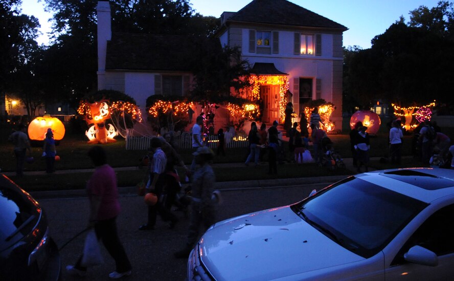 Families gather around a haunted house on Barksdale Air Force Base, La., Oct. 31, 2013. Barksdale Airmen and their families dressed in costumes and trick-or-treated around base. (U.S. Air Force photo/Senior Airman Kristin High)