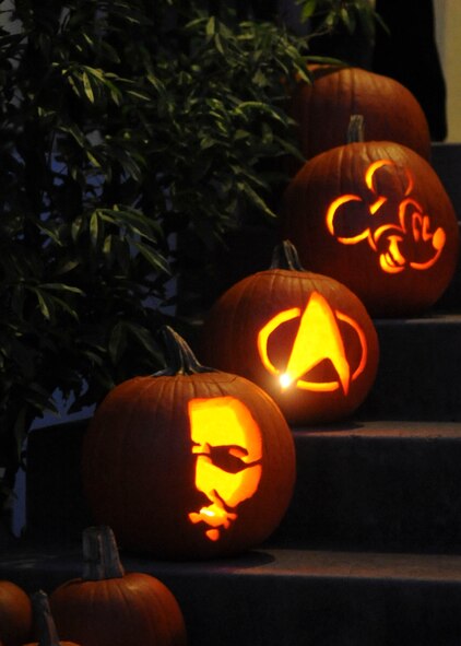 Hand-carved pumpkins are displayed in front of a house for Halloween on Barksdale Air Force Base, La., Oct. 31, 2013. Barksdale Airmen and their families decorated their homes and dressed up in costumes to celebrate the holiday. (U.S. Air Force photo/Senior Airman Kristin High)