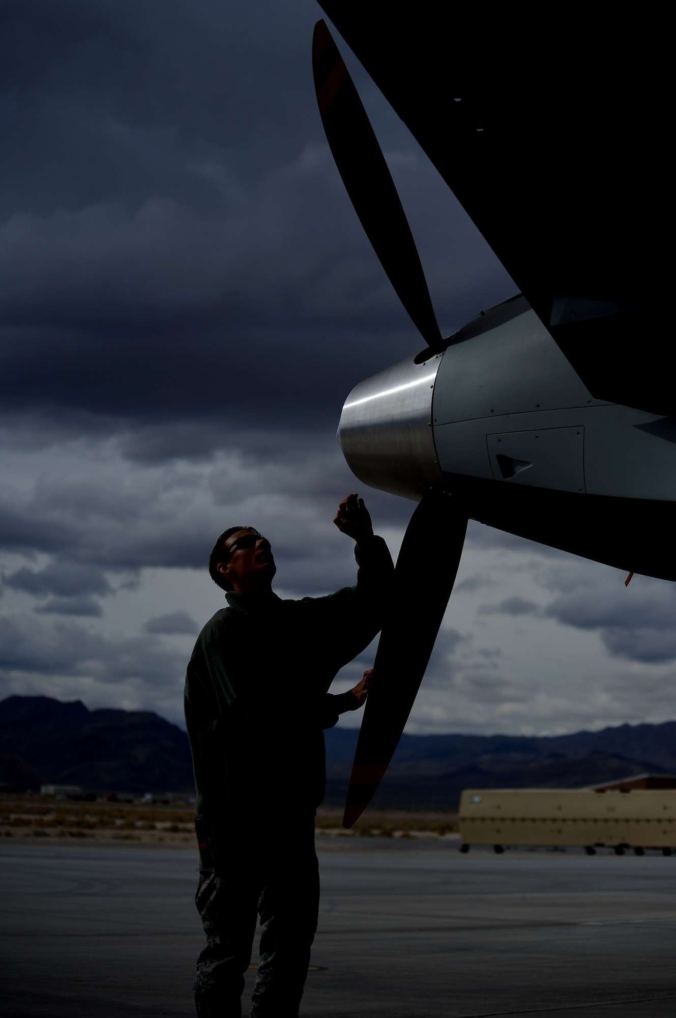 LAS VEGAS, Nev. -- A 432nd Aircraft Maintenance Squadron maintainer rotates the propeller of an MQ-9 Reaper remotely piloted aircraft during a post-flight inspection Oct. 28, 2013. The MQ-9 Reaper is an armed, multi-mission, medium-altitude, long-endurance RPA that is employed primarily as an intelligence-collection asset and secondarily against dynamic execution targets. The USAF’s MQ-9 Reaper and MQ-1 Predator fleet surpassed 2 million cumulative flight hours on Oct. 22, 2013. (U.S. Air Force photo by Staff Sgt. N.B./released)