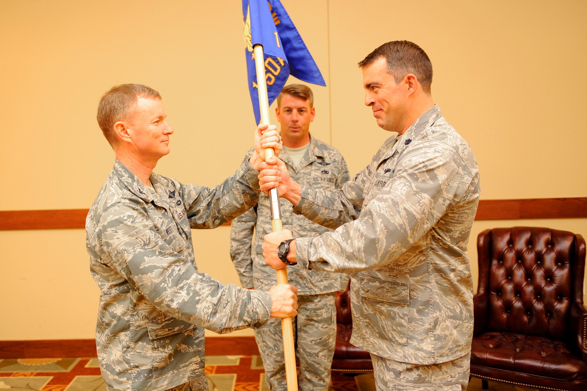 Lt. Col. Phil Forbes assumes command of the 1st Special Operations Air Operations Squadron at the Soundside Club on Hurlburt Field, Fla., Nov 1, 2013. The 1st SOAOS mission includes executing tactical-level command and control of all U.S aircraft and deploying 1st SOW aircraft. (U.S. Air Force photo/Airman 1st Class Jeff Parkinson)