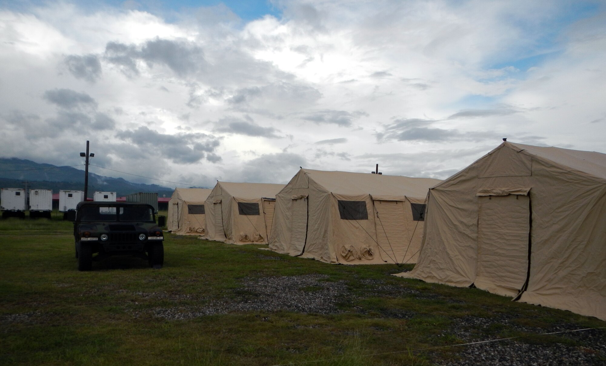 Members of Joint Task Force-Bravo's Army Forces Battalion (ARFOR) set up the Lite Expeditionary Camp system during the week of Oct. 28-Nov. 1, 2013.  The Lite Expeditionary Camp system consists of seven total tents, with the capability to house servicemembers and maintain military operations for up to ten years with proper upkeep.  (Photo by U.S. Army Spc. Christopher Floyd)