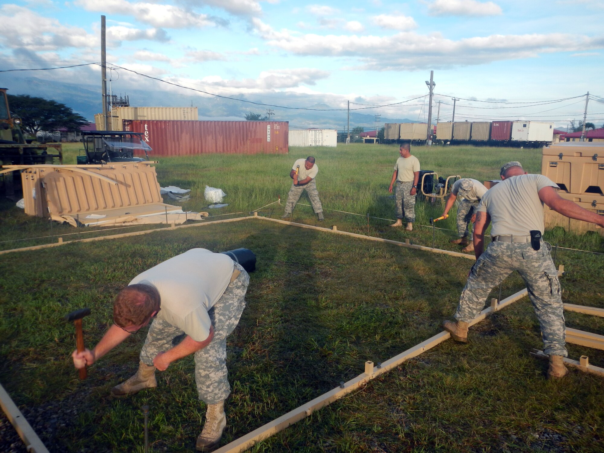 Members of Joint Task Force-Bravo's Army Forces Battalion (ARFOR) work on setting up a portion of the Lite Expeditionary Camp system, Oct. 29, 2013.  The Lite Expeditionary Camp system consists of seven total tents, with the capability to house servicemembers and maintain military operations for up to ten years with proper upkeep.  (Photo by U.S. Army Spc. Christopher Floyd)