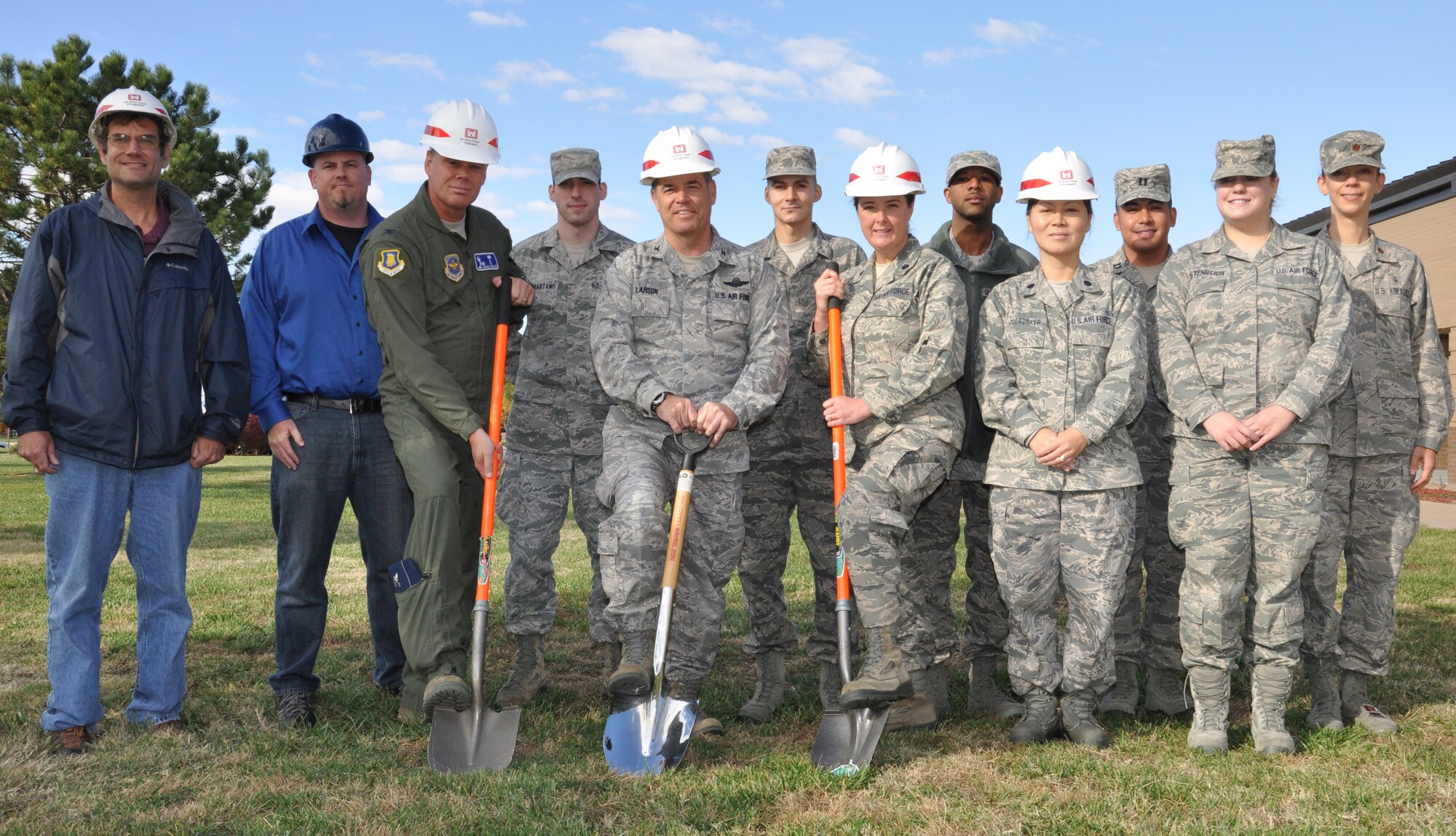 Left to right: (with shovels) Col. Charles R. Carlton, commander, 22nd Medical Group, Col. Col. Mark S. Larson, commander, 931st Air Refueling Group and Lt. Col. Michelle Van Sickle, commander, 931st Aeromedical Squadron, break ground on the 931st AMDS facility here, Nov. 1. The new building will provide the 931st AMDS and their customers with sufficient work and storage space to serve the medical needs of the 931st ARG. (Air Force photo by Master Sgt. Brannen Parrish)