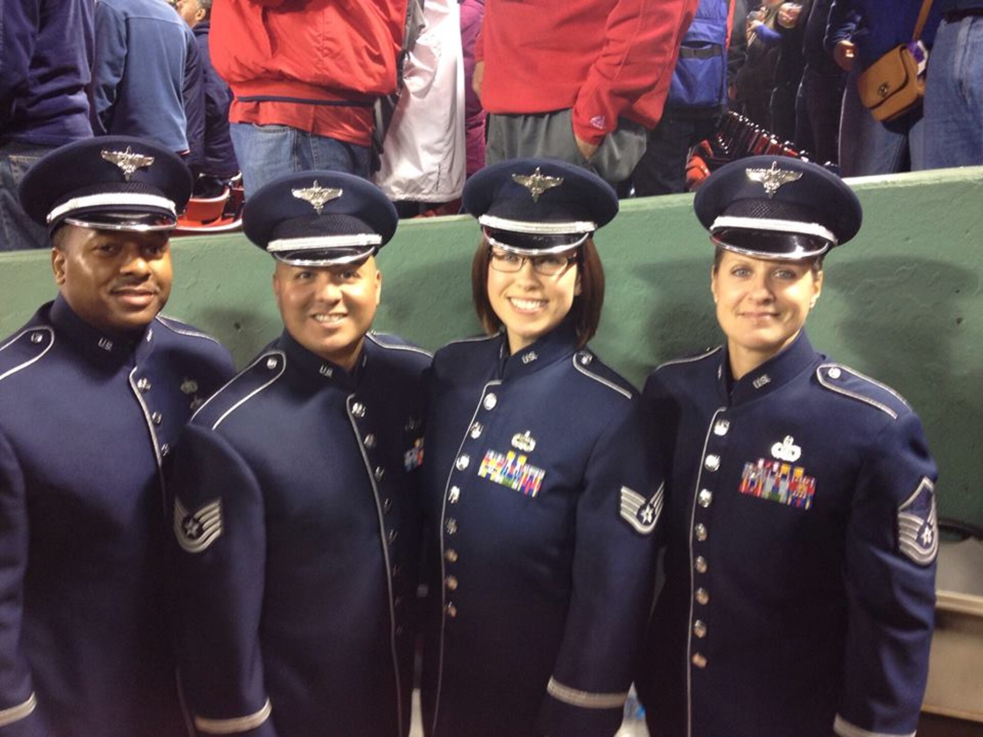 Master Sgt. Jennifer Dashnaw, Tech. Sgts. Niko Ellison and Quez Vasquez and Staff Sgt. Rachel Webber sang "God Bless America" during the seventh inning stretch of Game 6 of the World Series Oct. 30 at Fenway Park in Boston. (Courtesy Photo/Released)
