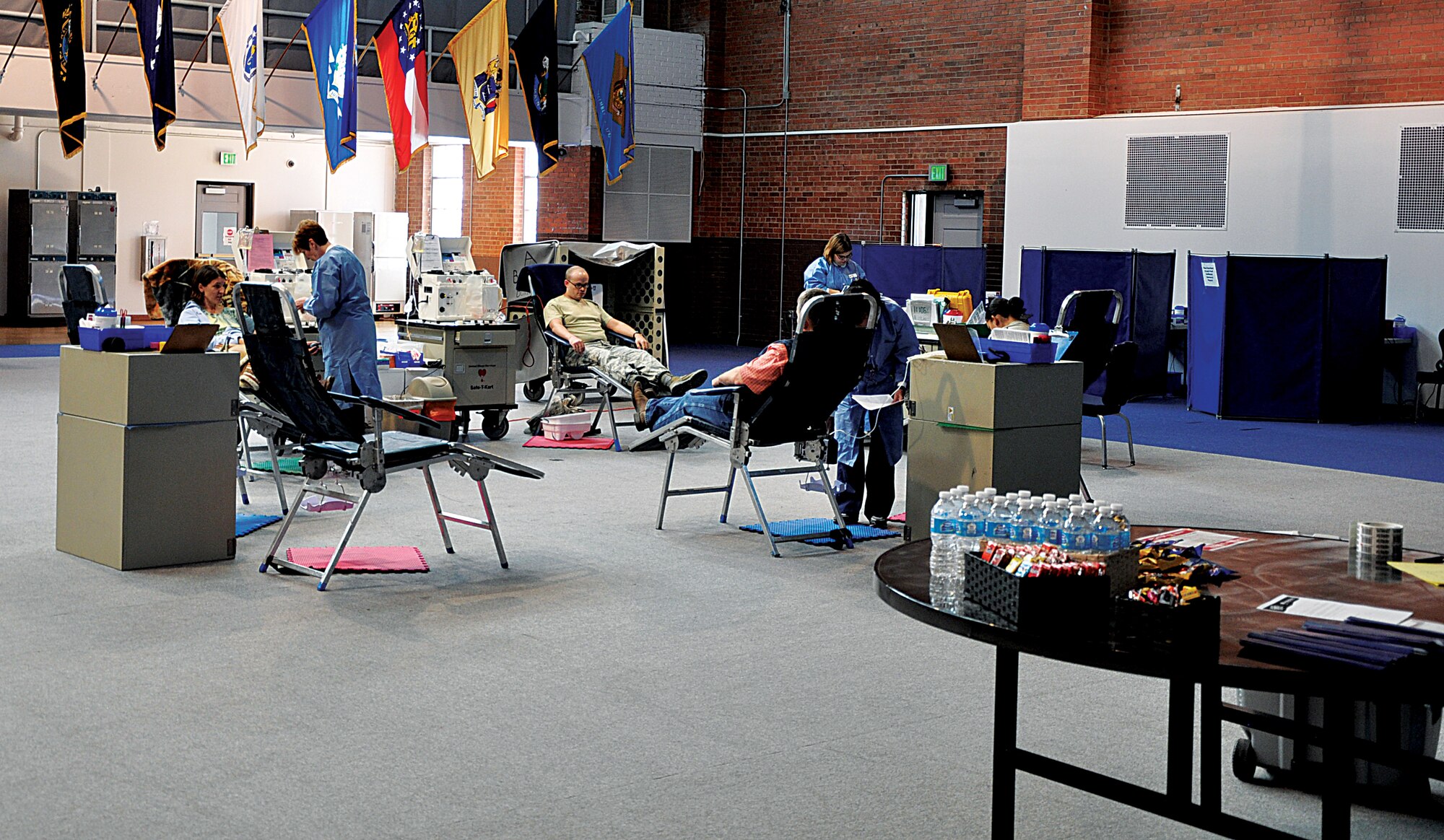 Airmen assigned to the 90th Missile Wing donate blood to the United Blood Services Nov. 1, 2013, in the Fall Hall Community Center, F. E. Warren Air Force Base, Wyo. (U.S. Air Force photo by Senior Airman Mike Tryon)