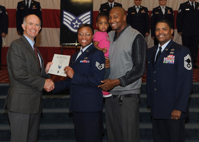 Staff Sgt. Faquita Jackson, Air Force Global Strike Command, receives a certificate of promotion from Jeffrey Beene, AFGSC Director of Staff, and Chief Master Sgt. Larry Tolliver, AFGSC Judge Advocate, during the October Wing Promotion Ceremony on Barksdale Air Force Base, La., Oct. 31, 2013. (U.S. Air Force photo/Senior Airman Joseph A. Pagán Jr.)