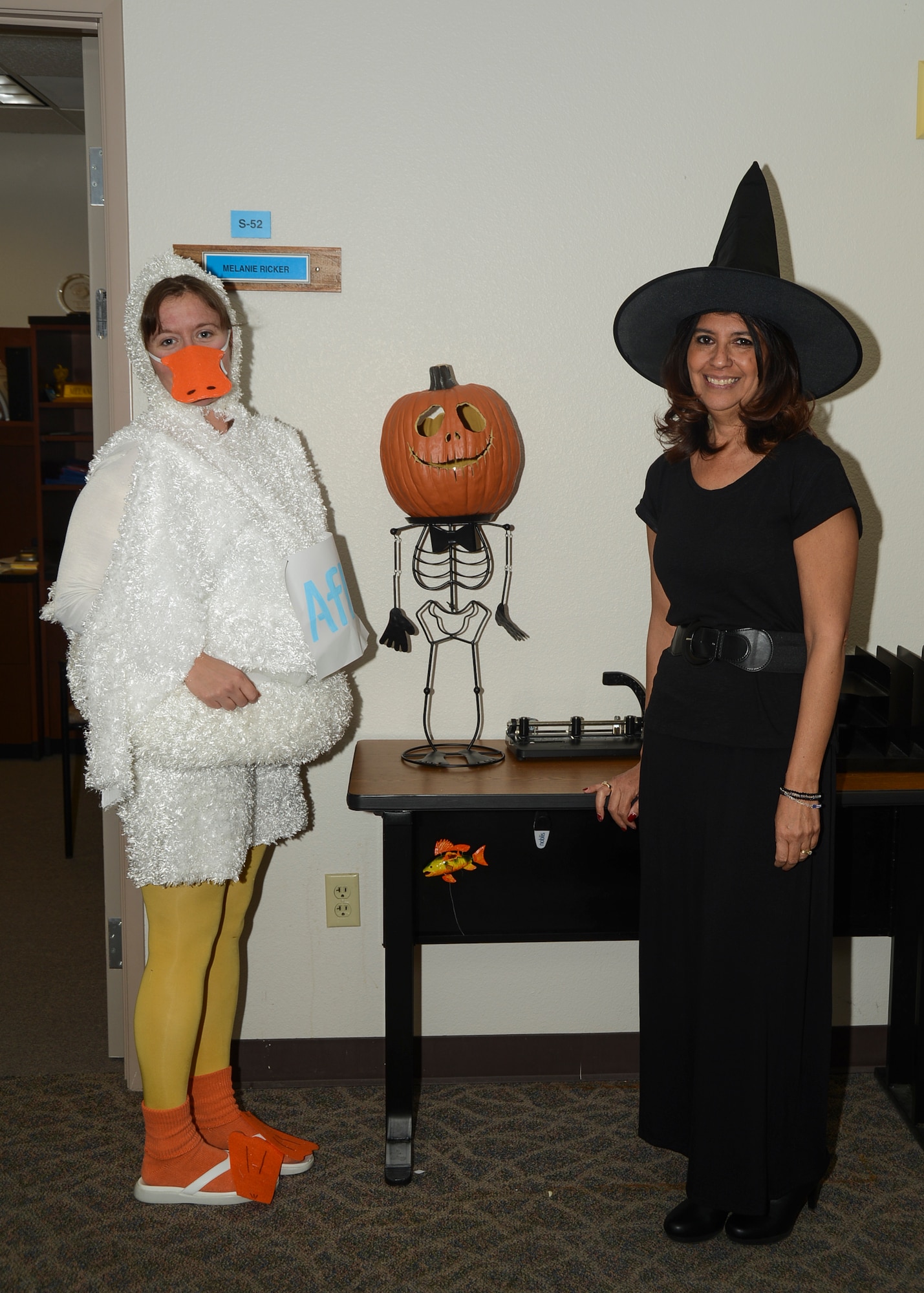 Megan Gipson (left), procurement analyst, took second in the women’s category as the Aflac Duck and Margie Gutierrez, Financial Management, dressed up as the good witch. (U.S. Air Force photo by Rebecca Amber)