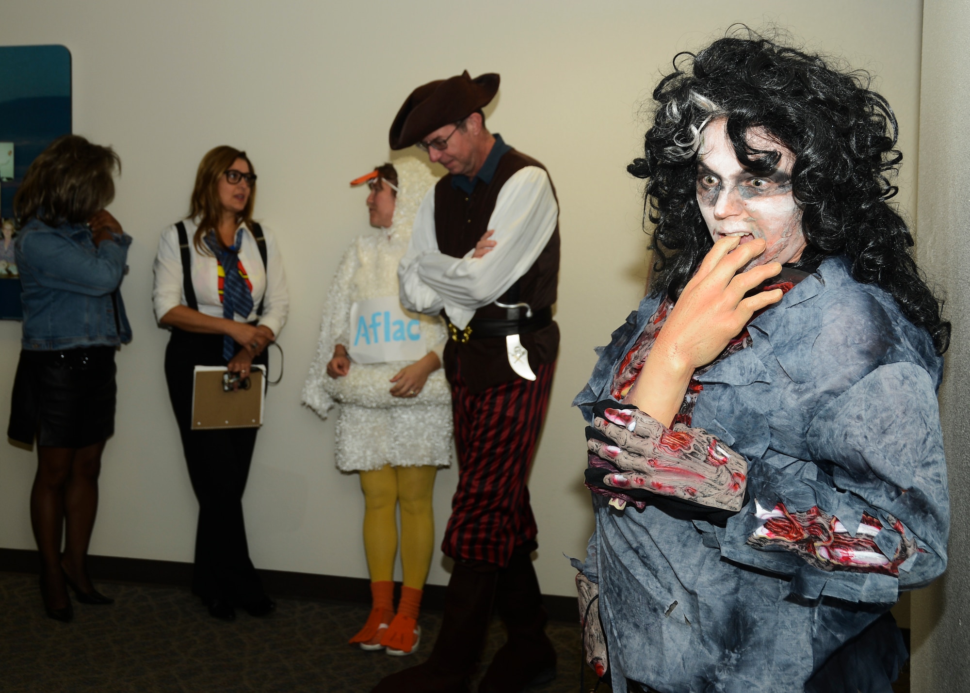 Senior Airman Elizabeth Heaton (far right), enjoys a "snack" before the 412th Comptrollers Squadron hosted a costume contest on Halloween. (U.S. Air Force photo by Rebecca Amber)
