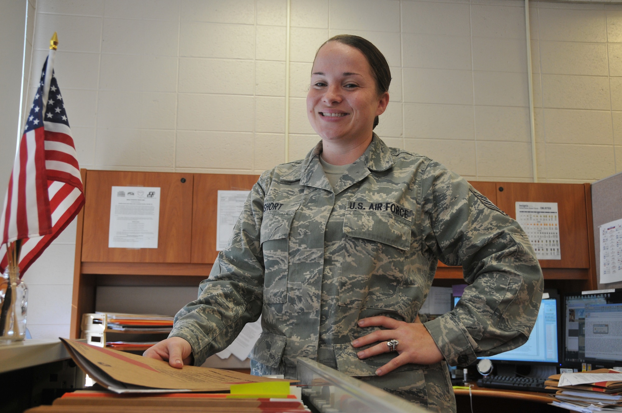 U.S. Air Force Tech. Sgt. Olivia Short, human resources specialist, Delaware National Guard Joint Force Headquarters, at her work center in Wilmington, Del., Oct. 23, 2013. She has three girls enrolled in the Tender Loving Kare child care facility on drill weekends. (U.S. Air National Guard photo by Staff Sgt. Nathan Bright)